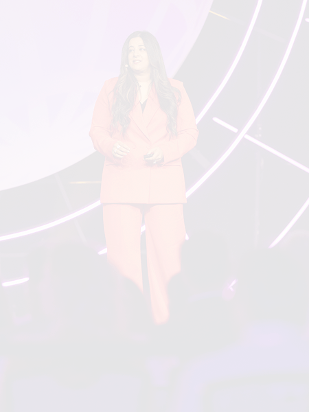 Sara the dentist is joyfully smiling on the stage