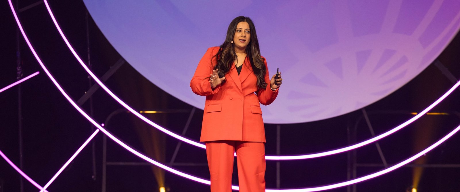 Sara the dentist is smiling on stage