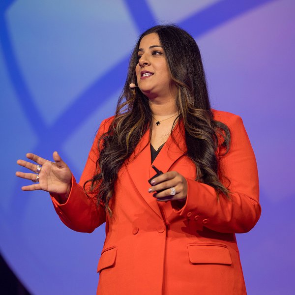 Sara the dentist is smiling on stage